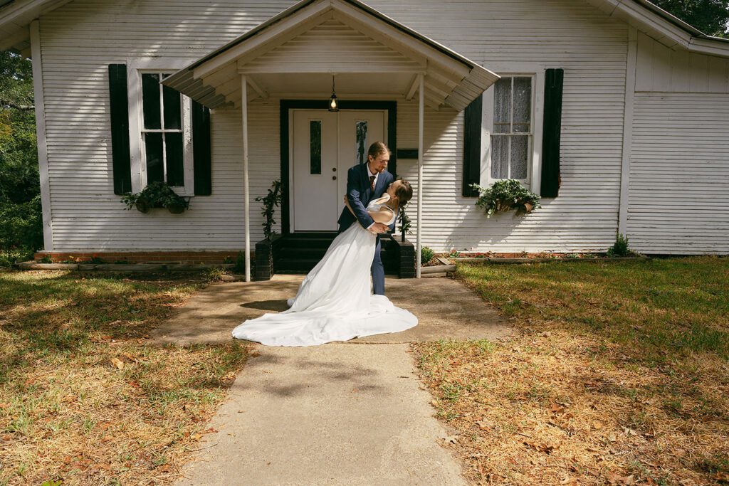 bride and groom in front of the chapel in rusk tx taken by annie austin photography