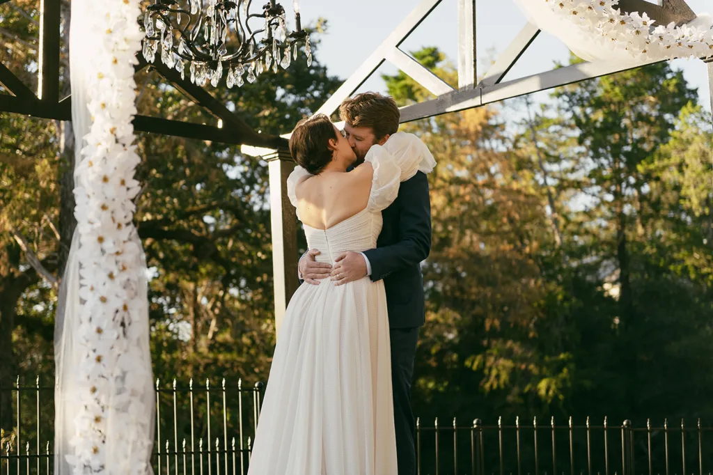 Documentary Wedding photography of first kiss at Red Ridge Receptions