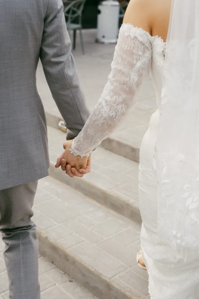 couples hands just after getting married at the grove in tyler texas