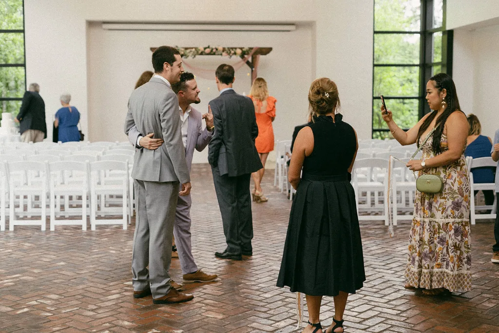 guests mingle inside prior to wedding ceremony at the grove in tyler tx