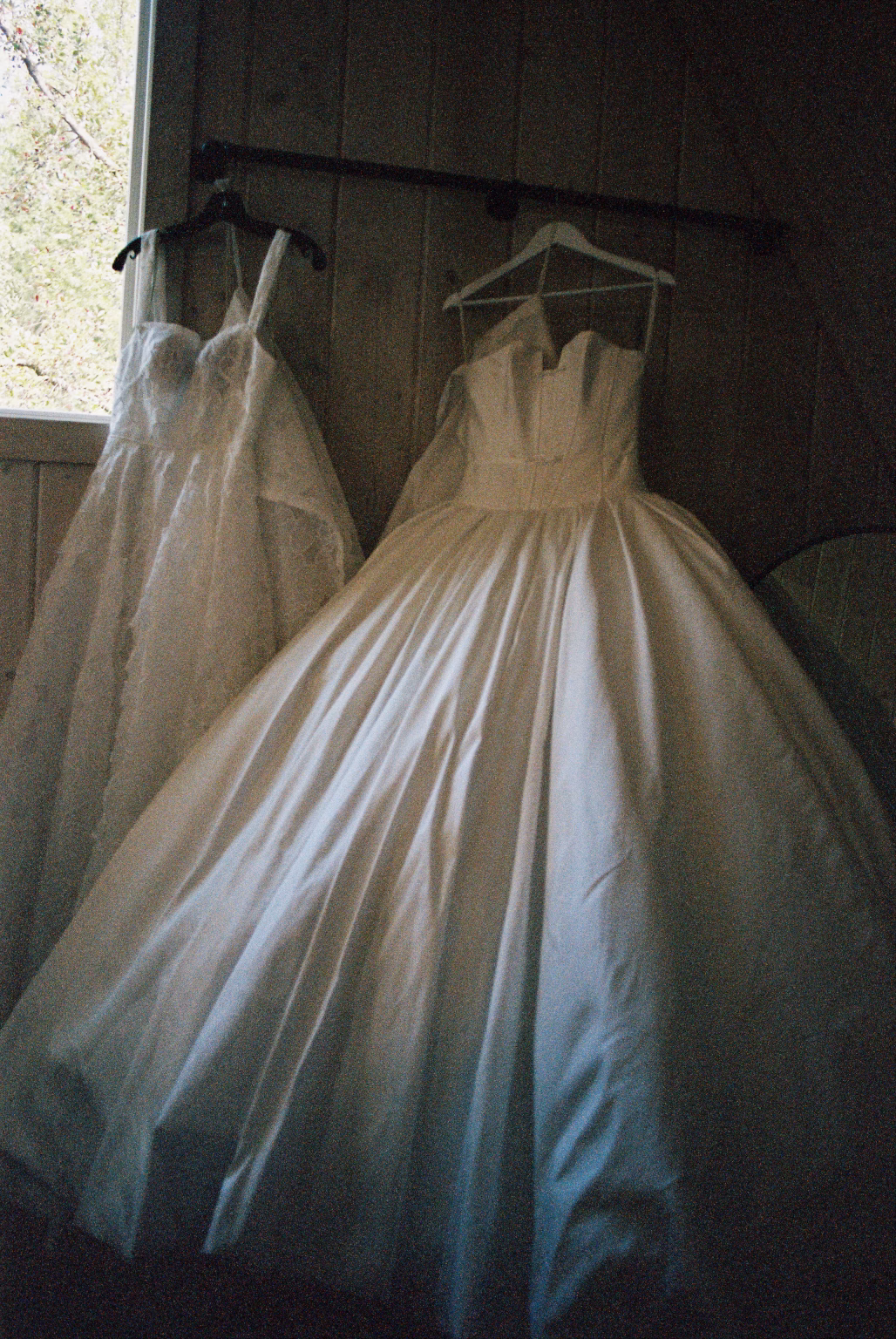 film photo of dresses hanging in bridal suite at an East Texas venue